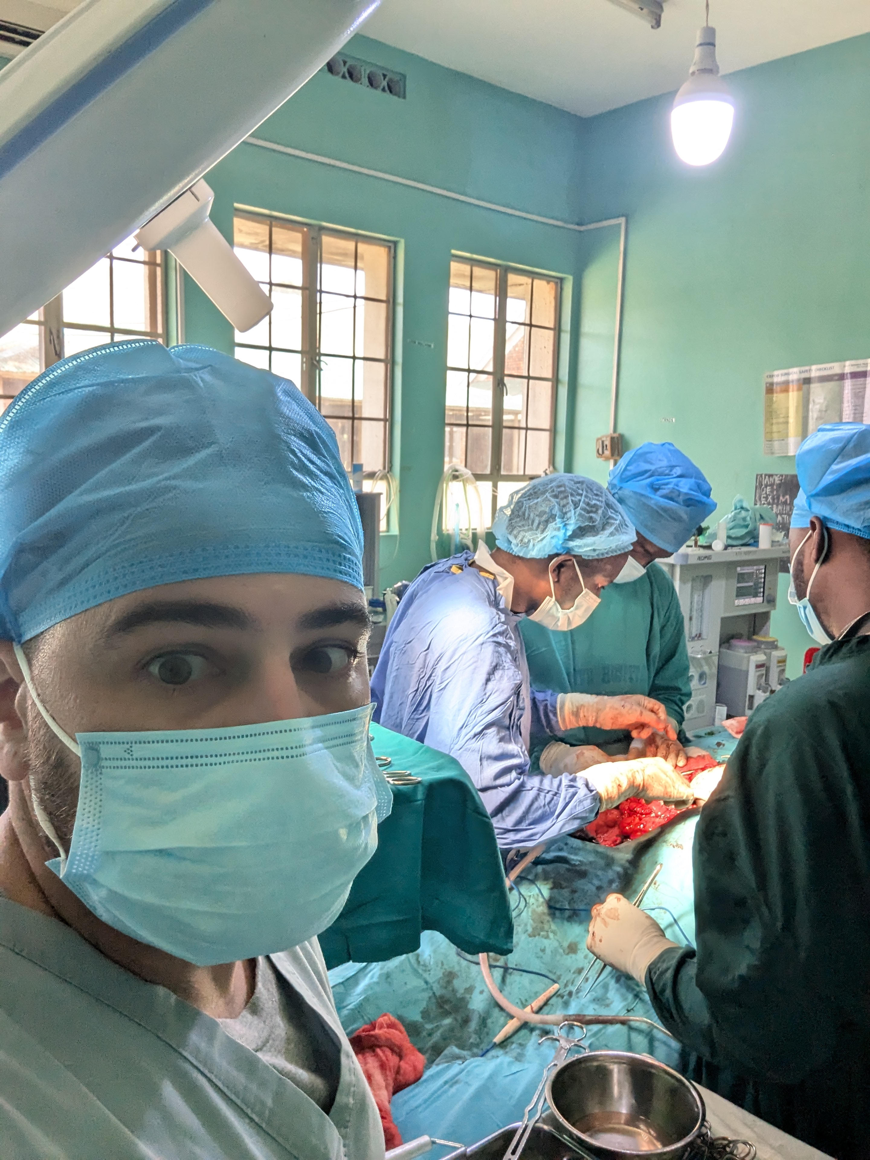 Medical professionals providing surgical care during an international mission